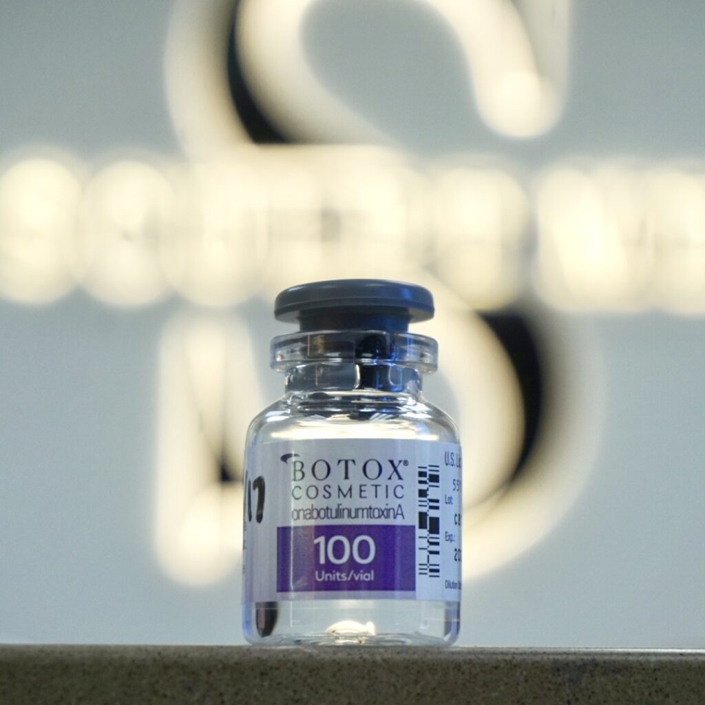 Botox vial on counter macro product photography in front of Sculpt MD sign. Staged & taken by Alyssa C.